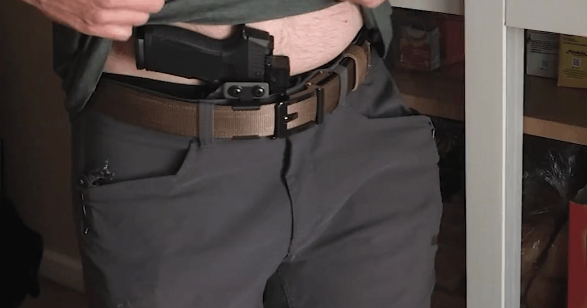 A man wearing a Glock 19 with an inside-the-waistband holster from NeoMag.