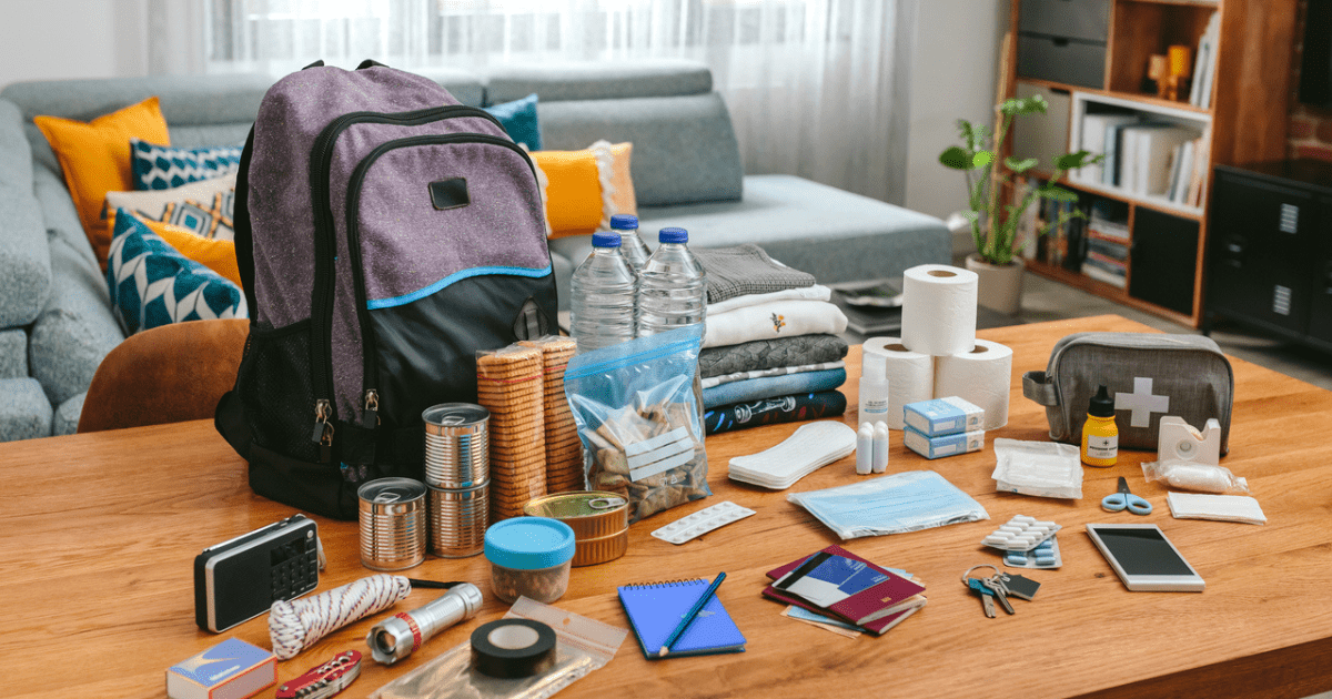 Supplies layed out on a table ready to be put in a go bag.