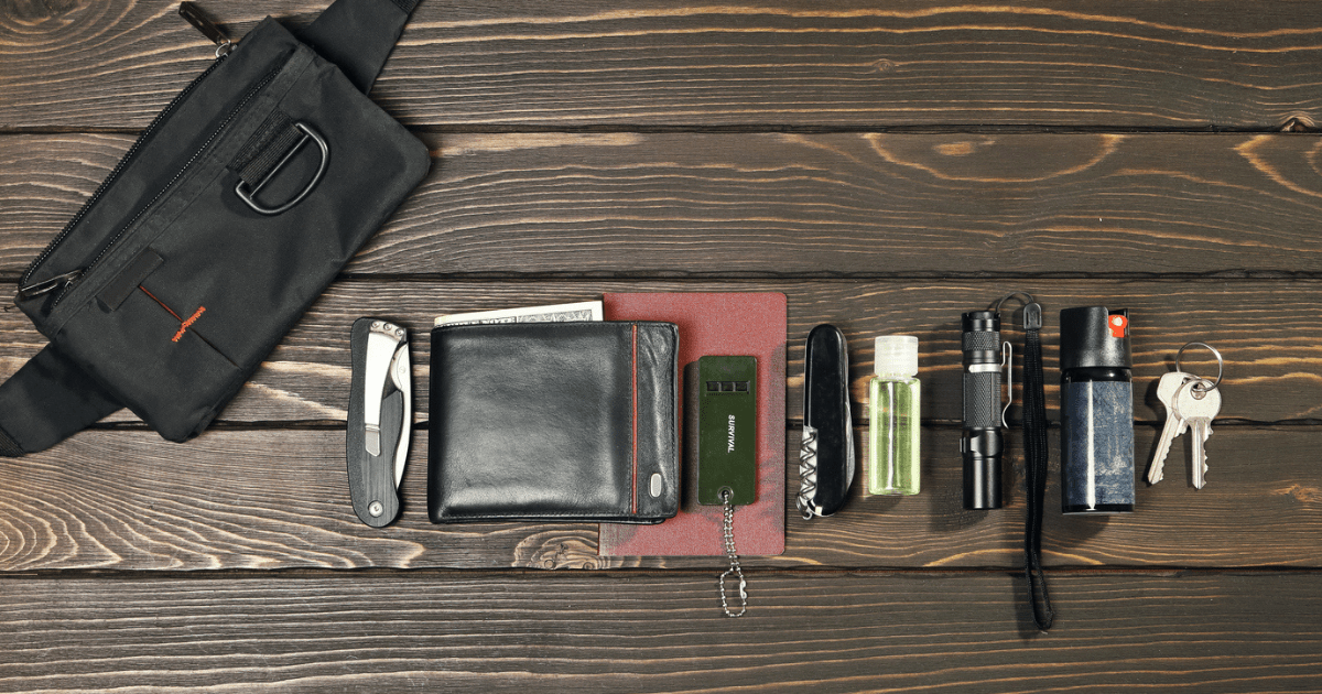 EDC gear laid out on a brown table.