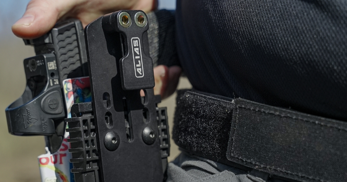 An Alias Drop Adapter attached to a holster.