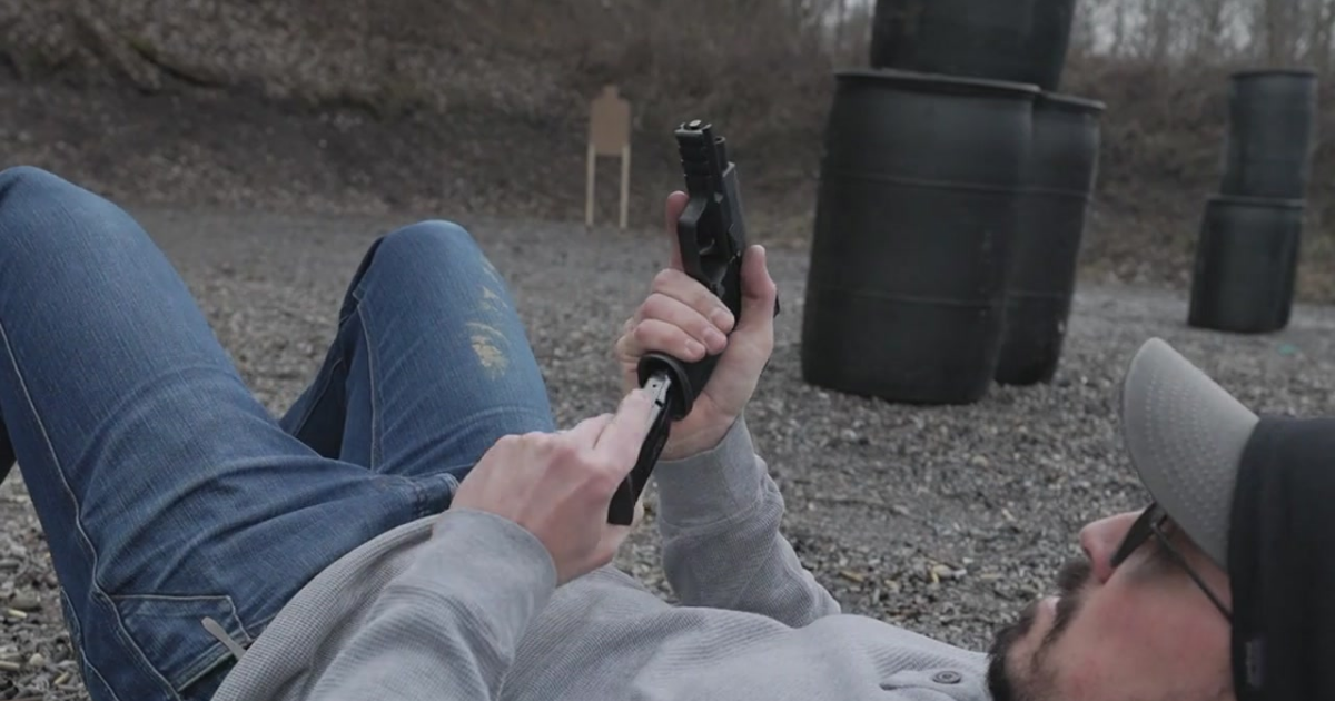 A man praticing reloads at the range.