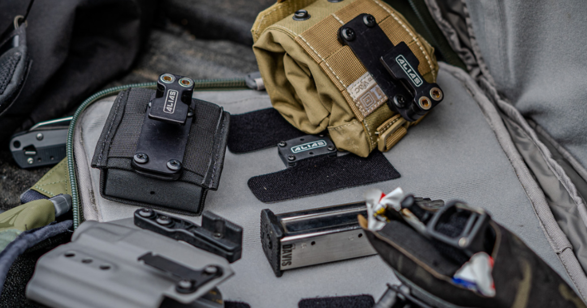 Different shooting range gear layed out on a car seat ready to be organized into a range bag.